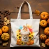 Cozy autumn tote bag mockup with “It’s Fall Y’all” PNG sublimation design featuring coffee, pumpkins, and sunflowers