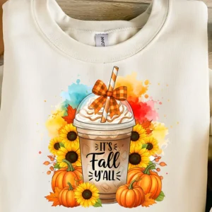 Mockup of “It’s Fall Y’all” sublimation PNG design on a women’s fall sweatshirt with pumpkin spice coffee, sunflowers, and plaid bow