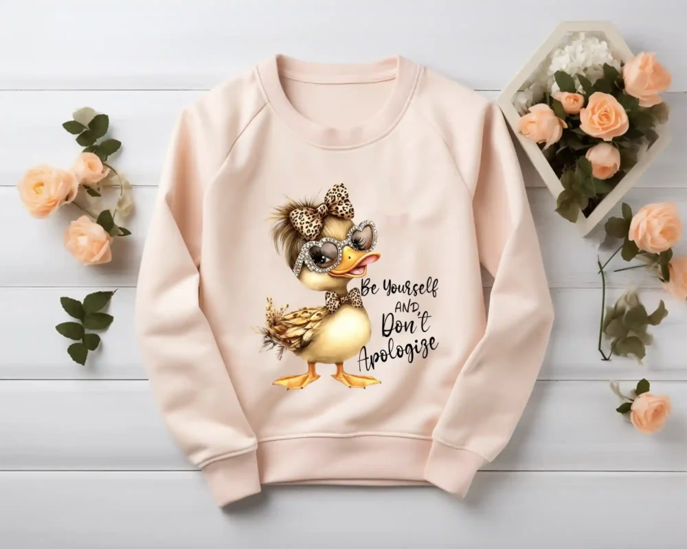 Blush sweatshirt mockup displaying Be Yourself And Don’t Apologize duck design