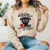 Girl wearing light brown sweatshirt with sarcastic morning dog coffee design