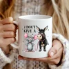 Woman holding mug with Funny Donkey PNG design