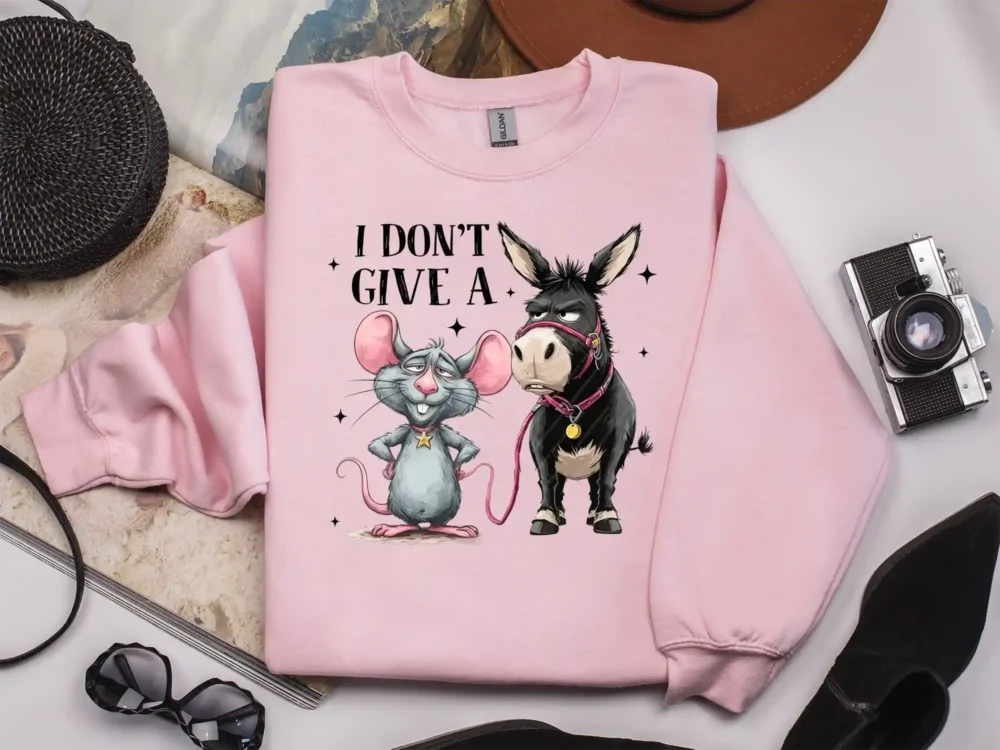 Light pink sweatshirt featuring I Don’t Give a Rat’s Ass funny rat and donkey design