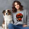 Girl sitting with dog wearing grey sweatshirt with afro inspired artwork