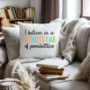 White decorative pillow with a Spectrum of Possibilities design