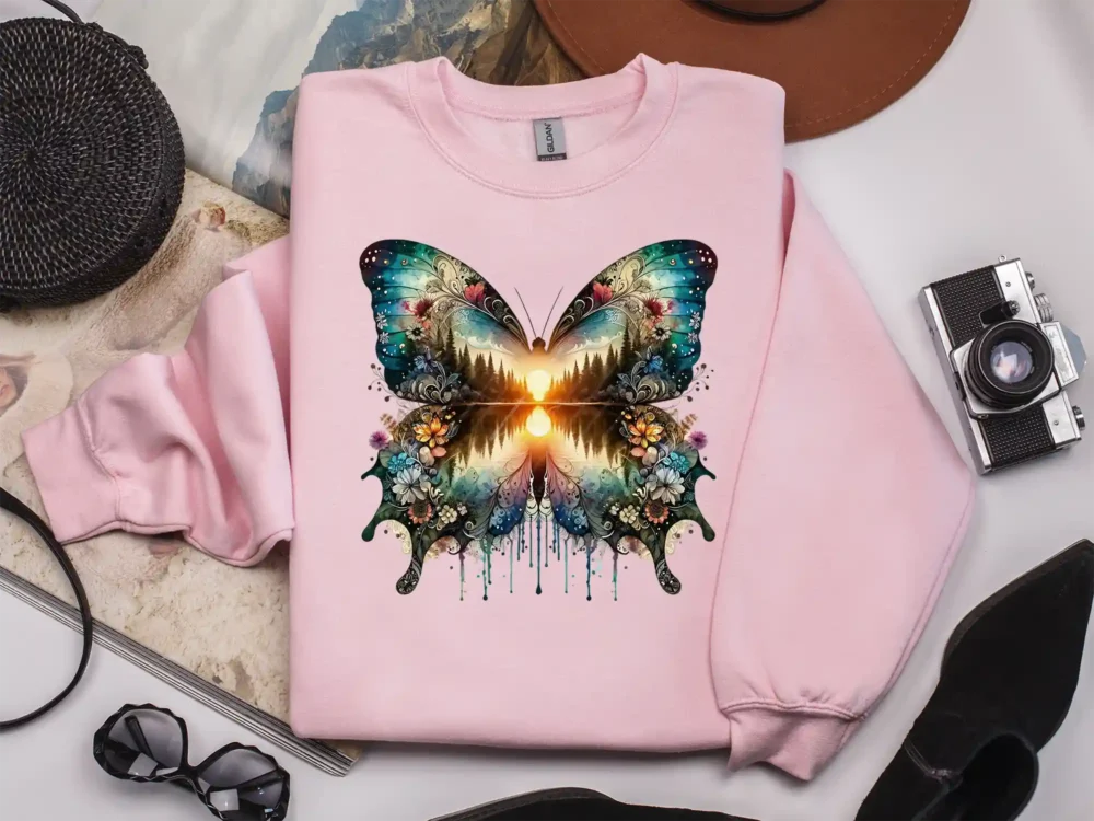 Boho style butterfly sublimation design on pink apparel.