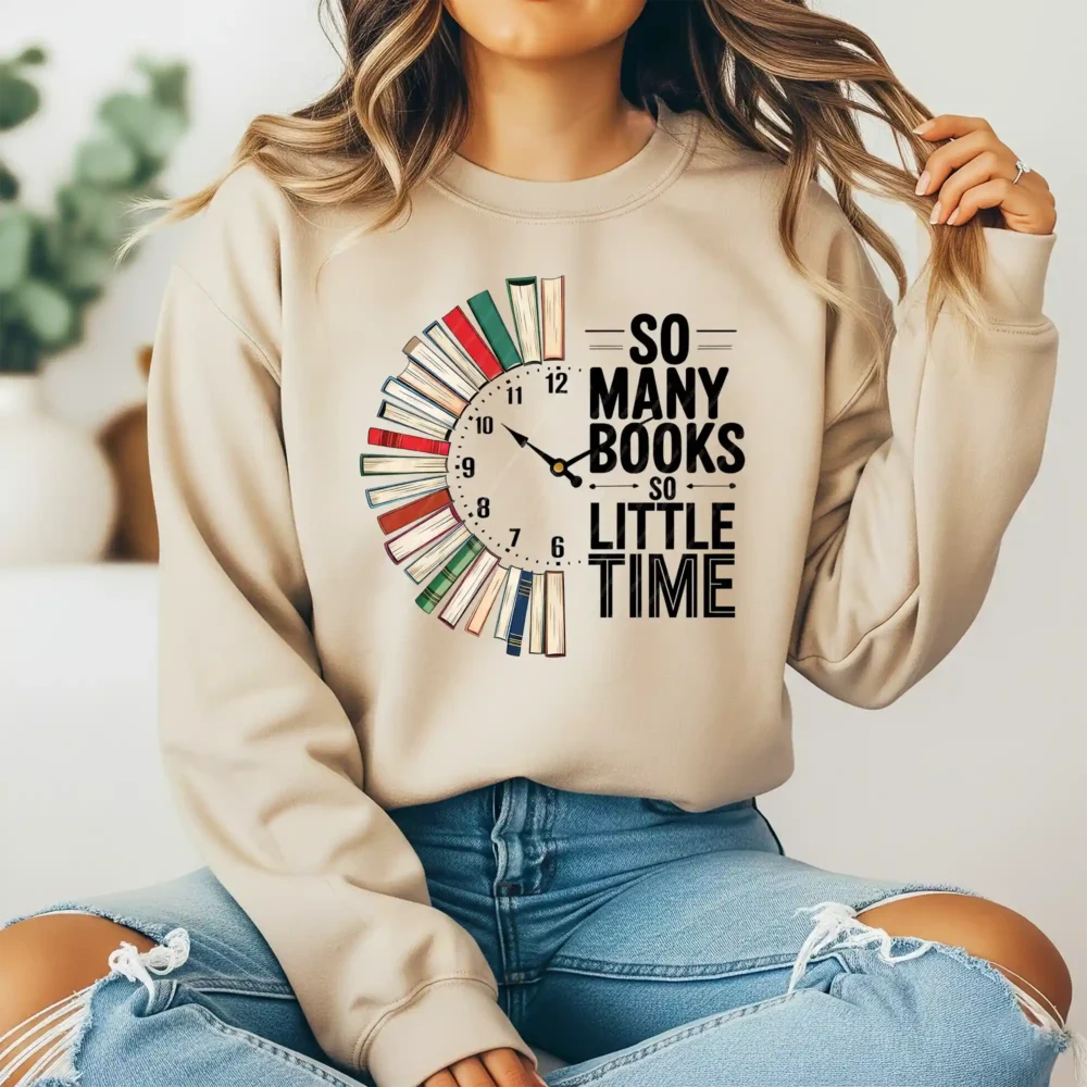 Girl wearing light brown sweatshirt with book clock reading design