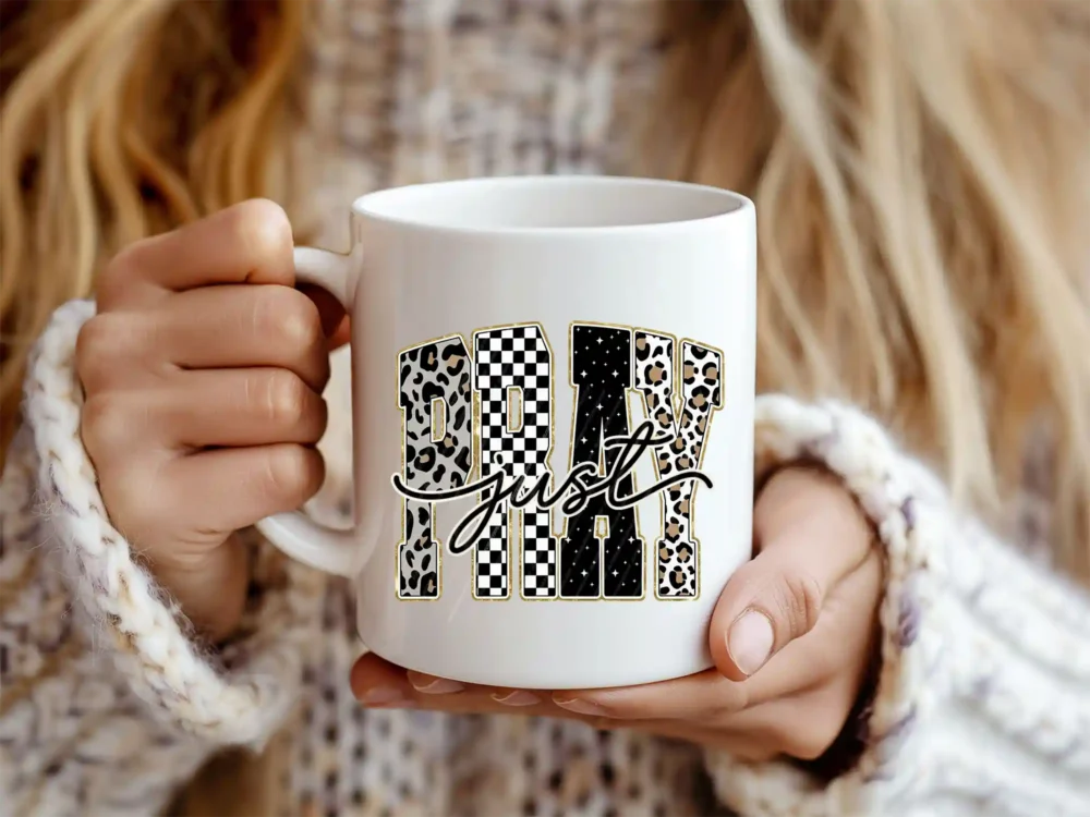 Woman holding mug with Christian PRAY PNG design