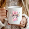 Bubblegum highland cow design displayed on white mug