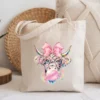 Canvas tote bag mockup featuring trendy bubblegum cow design
