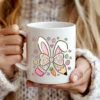 White coffee mug featuring the Easter Teacher Coquette PNG