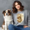 Girl sitting with dog wearing grey sweatshirt with cow design