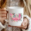White coffee mug featuring the Floral Teacher Faux Knitted PNG
