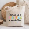 Natural canvas tote bag featuring a Spectrum of Possibilities graphic