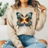 Girl wearing a brown sweatshirt with a Boho Sunset Butterfly