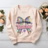 Vibrant Rainbow Knitted Teacher PNG with 3D braided yarn textures and a glittery coquette bow