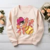 Softball Mom shirt design on a blush pink crewneck sweatshirt