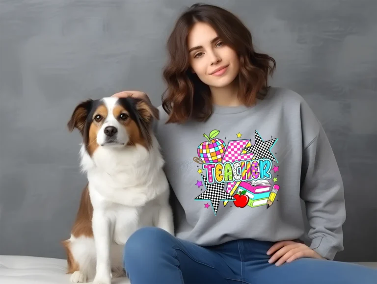 A bold, retro-style "Teacher" design featuring a pink and white checkered lightning bolt and a disco-ball apple. The letters have various patterns like lime green leopard and orange stripes. Black and white checkered stars and colorful schoolbooks complete this high-energy graphic
