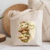 Canvas tote bag featuring cute peeking cow design