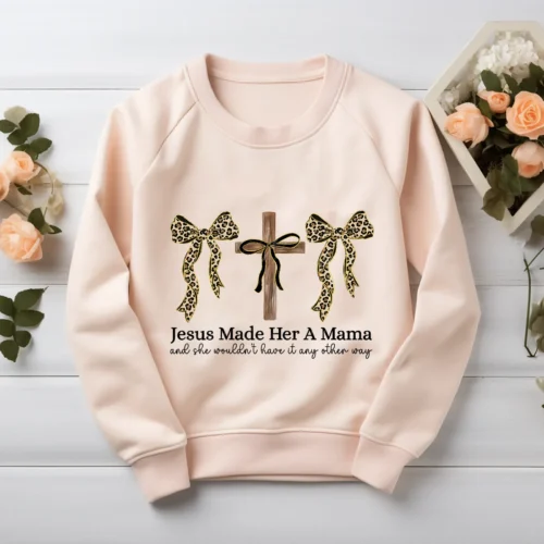 Coquette Christian Mama PNG printed on a blush sweatshirt