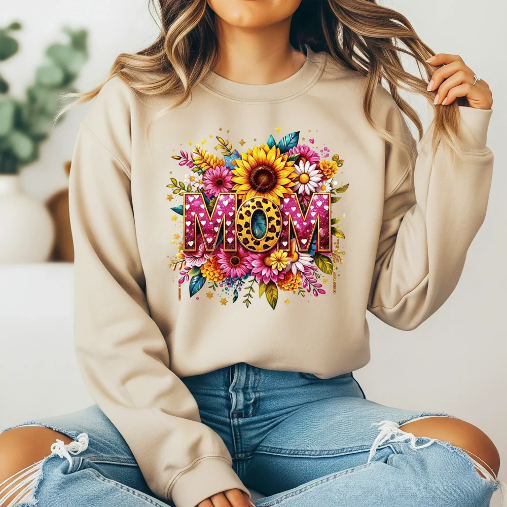 Girl in a light brown sweatshirt showing off a leopard print mom design