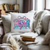 Decorative white pillow featuring a colorful floral mama graphic