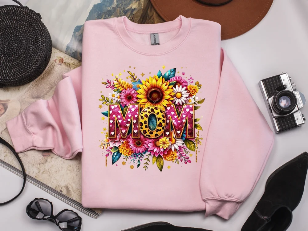 Light pink sweatshirt featuring a high-quality mama shirt design with sunflowers