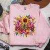 Light pink sweatshirt featuring a high-quality mama shirt design with sunflowers