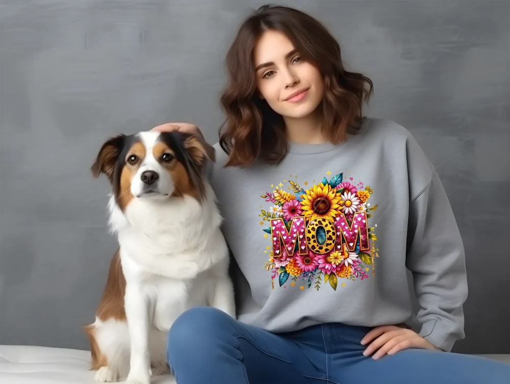 Woman with her dog wearing a grey sweatshirt with a mom life PNG floral design