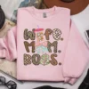Mom Wife Boss PNG featured on a light pink sweatshirt