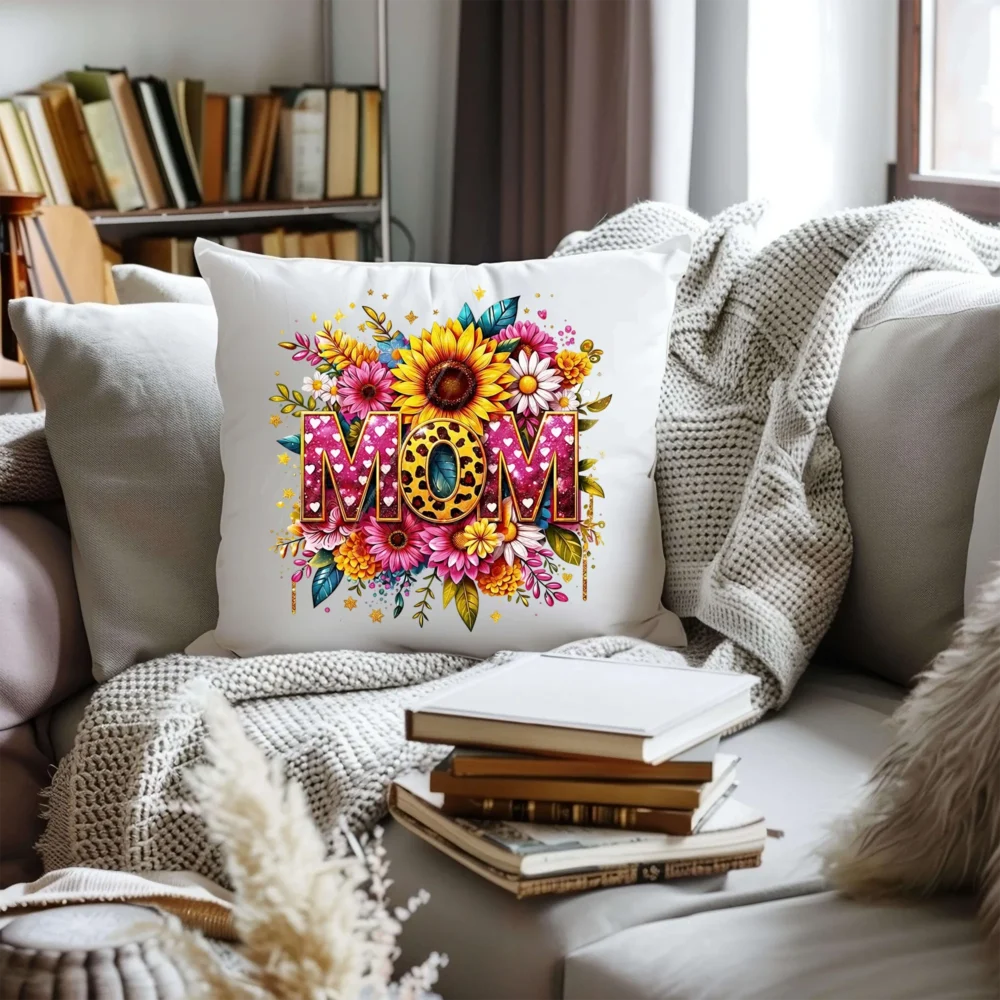 White decorative pillow with a vibrant Mothers Day PNG floral arrangement