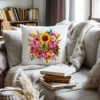 White decorative pillow with a vibrant Mothers Day PNG floral arrangement