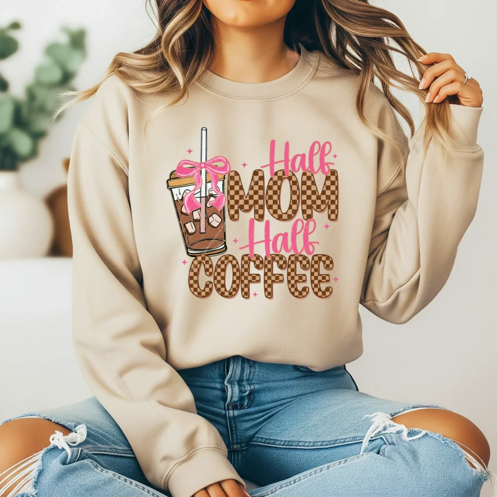 Girl wearing a light brown sweatshirt with Western Mama PNG coffee design