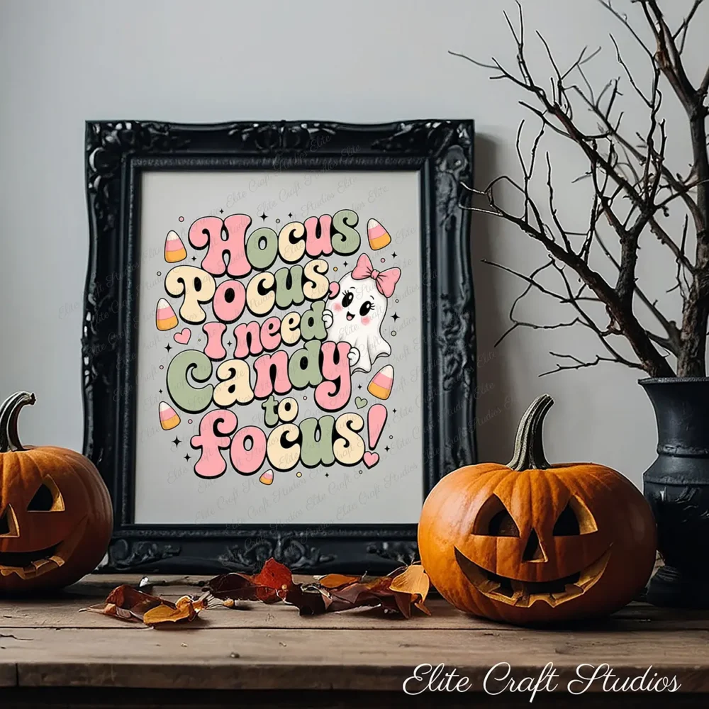Black ornate picture frame displaying cute Halloween art print on a rustic wood table, flanked by carved jack-o'-lanterns and dark decorative autumn branches.