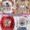 Main thumbnail showing a 4-way grid of retro coquette halloween sublimation PNG designs on sweaters including Creep it real black cat, Fangs for my ghoul-friend ghosts, Skele-ton peace sign, and Love at first bite bat. Badge reads 10 Pink Halloween PNG Bundle, 300 DPI, Transparent.