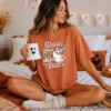 Pink coquette Halloween PNG Ghouls Just Want to Have Fun on an oversized terracotta t-shirt mockup