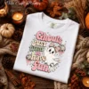 Retro Halloween PNG graphic Ghouls Just Want to Have Fun on a white folded t-shirt flat lay
