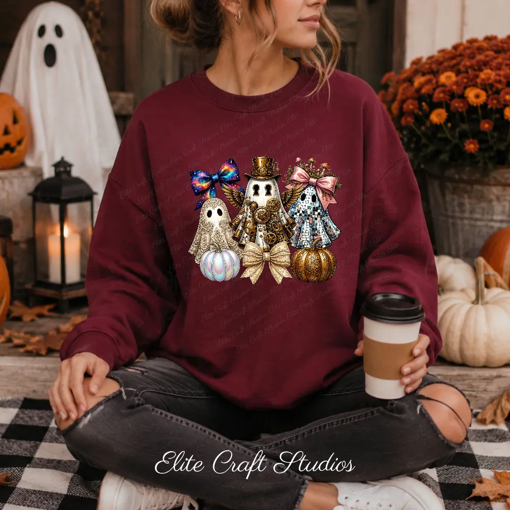 Woman sitting outdoors on a porch holding coffee, wearing a maroon crewneck sweatshirt printed with a steampunk ghost PNG design next to white pumpkins.