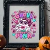 Black ornate picture frame displaying the Just a Ghoul Who Loves Pink graphic, placed on a wooden mantle flanked by carved jack-o'-lanterns.